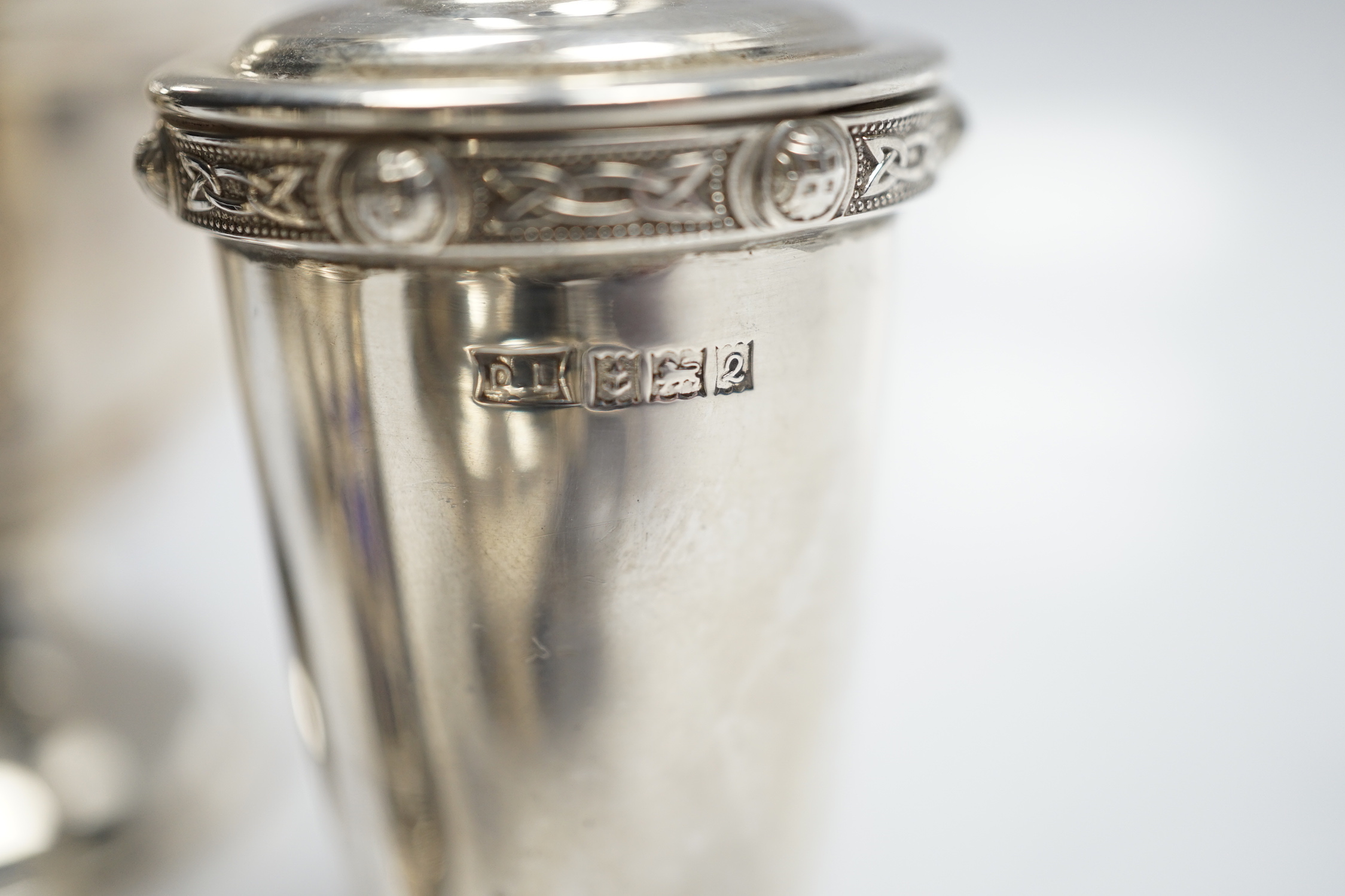 A modern silver baluster sugar caster by Elkington & Co and four assorted silver condiments.